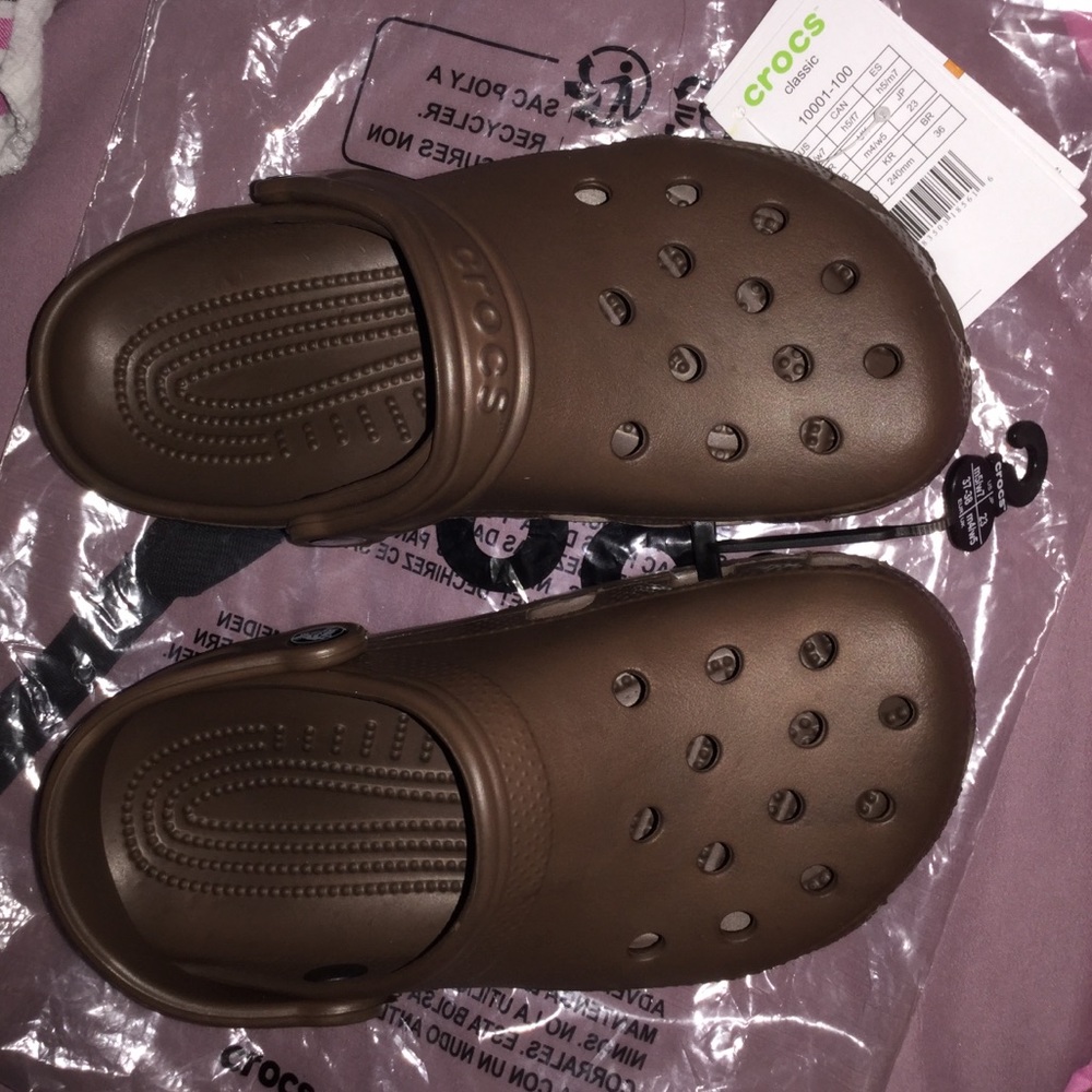 Dark brown crocs with jibbitz